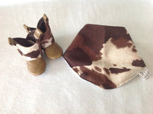Load image into Gallery viewer, Brown & White Cow Print Baby Cowboy Boots and Bib