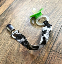 Load image into Gallery viewer, Black &amp; White Cow Print Pacifier Clip